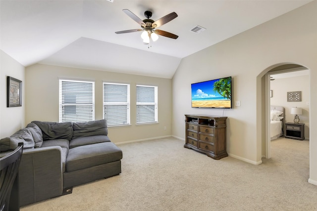 13823 Pointed Edge Ln, Cypress, TX 77429 - living area with arched walkways, a ceiling fan, carpet flooring, vaulted ceiling, and baseboards