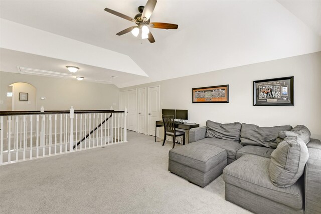 13823 Pointed Edge Ln, Cypress, TX 77429 - carpeted living room featuring a ceiling fan, lofted ceiling, and arched walkways