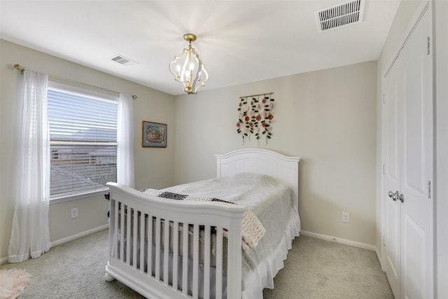 13823 Pointed Edge Ln, Cypress, TX 77429 - bedroom featuring baseboards, light carpet, a chandelier, and a closet