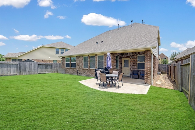 13823 Pointed Edge Ln, Cypress, TX 77429 - rear view of house with a patio area, brick siding, and roof with shingles