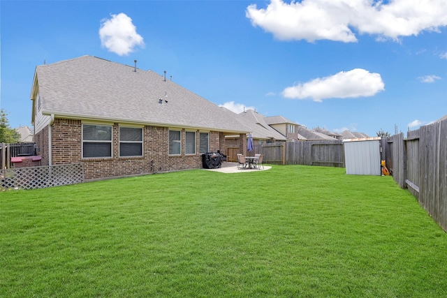 13823 Pointed Edge Ln, Cypress, TX 77429 - rear view of property with brick siding, a patio area, and roof with shingles