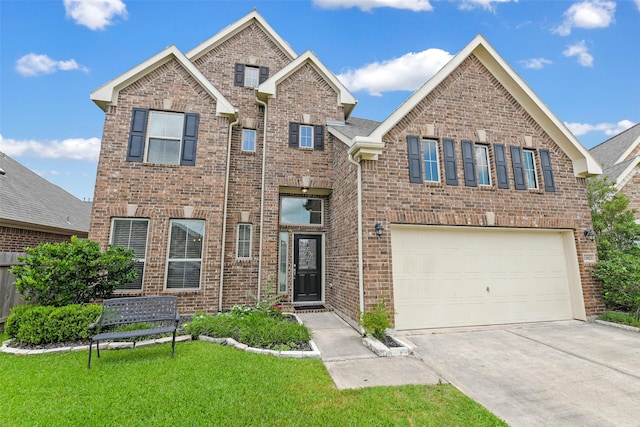 13823 Pointed Edge Ln, Cypress, TX 77429 - view of front of home with brick siding, concrete driveway, an attached garage, and a front yard