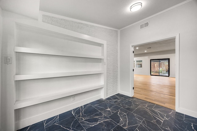 1931 Chaparral Dr, Houston, TX 77043 - hallway with built in shelves and dark marble finish flooring