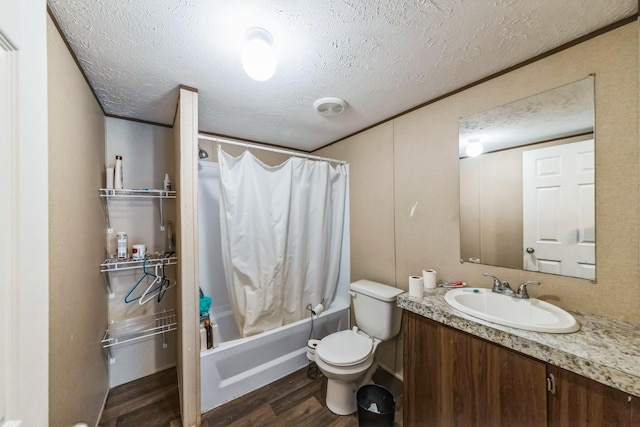 17968 County Road 426, Brazoria, TX 77422 - full bath with wood finished floors, shower / bath combo with shower curtain, vanity, toilet, and a textured ceiling