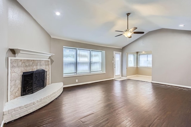 5607 Circlegate Dr, Spring, TX 77373 - unfurnished living room featuring lofted ceiling, ceiling fan, a fireplace with raised hearth, wood finished floors, and baseboards