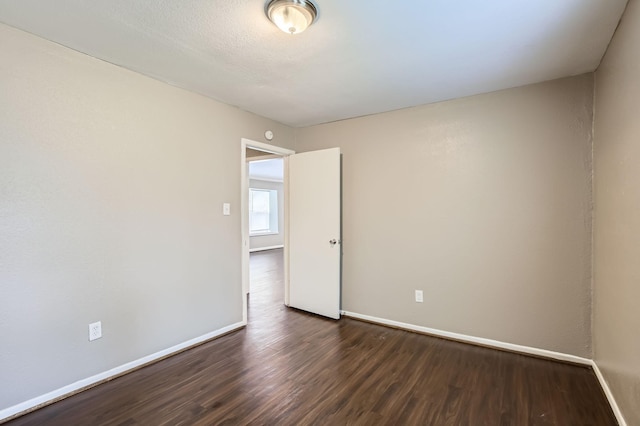 5607 Circlegate Dr, Spring, TX 77373 - unfurnished room with dark wood-style flooring and baseboards