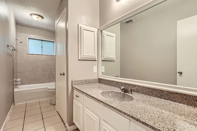 5607 Circlegate Dr, Spring, TX 77373 - full bathroom featuring vanity, tile patterned flooring, toilet,  shower combination, and a textured ceiling