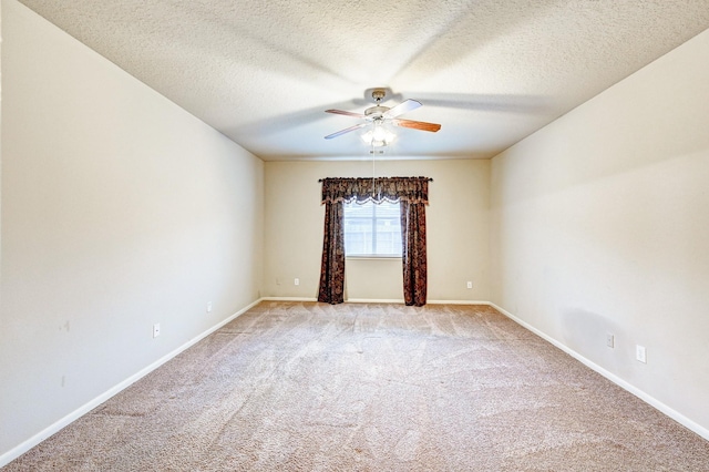1752 Cypress Meadows Dr, Dickinson, TX 77539 - unfurnished room featuring a ceiling fan, light carpet, baseboards, and a textured ceiling