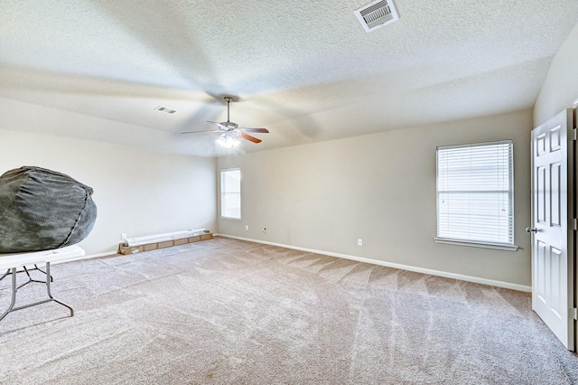 1752 Cypress Meadows Dr, Dickinson, TX 77539 - carpeted spare room featuring a ceiling fan, baseboards, and a textured ceiling