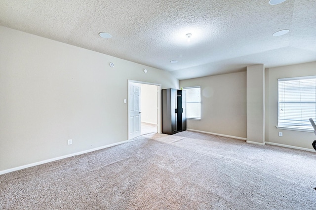 1752 Cypress Meadows Dr, Dickinson, TX 77539 - unfurnished room with carpet flooring, a textured ceiling, and baseboards