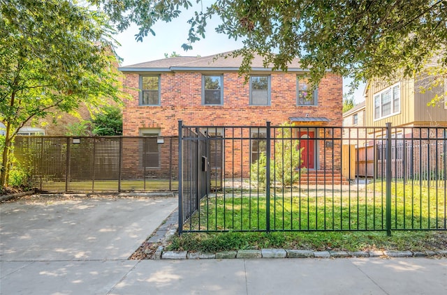 2308 Blodgett St, Houston, TX 77004 - view of front facade featuring brick siding, a gate, and driveway