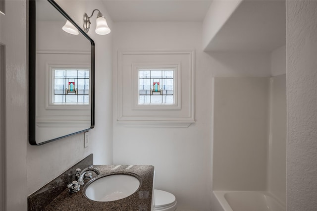 2308 Blodgett St, Houston, TX 77004 - bathroom featuring vanity, healthy amount of natural light, toilet, and shower / washtub combination
