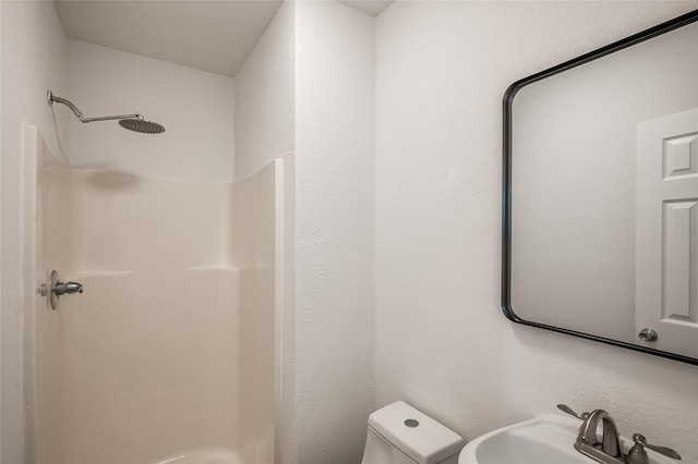 2308 Blodgett St, Houston, TX 77004 - bathroom featuring a sink, a shower, and toilet