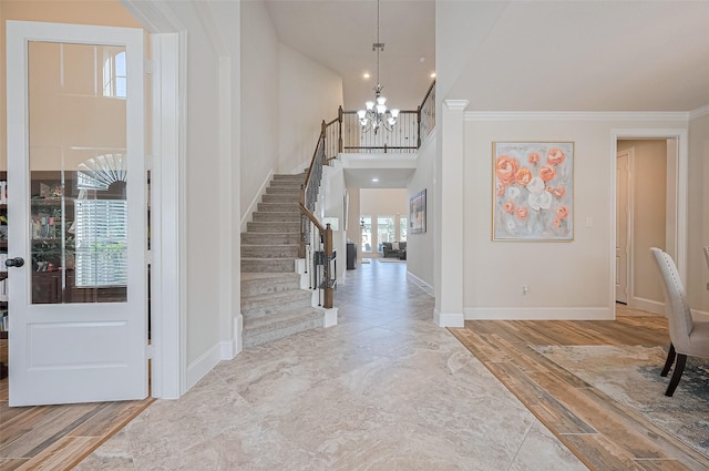 27815 Carol Collier Ct, Katy, TX 77494 - entryway with a chandelier, stairway, ornamental molding, and a high ceiling