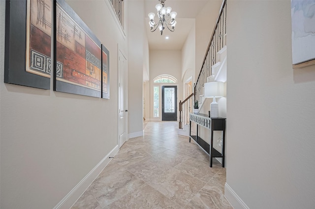27815 Carol Collier Ct, Katy, TX 77494 - corridor featuring a chandelier, stairs, and a high ceiling