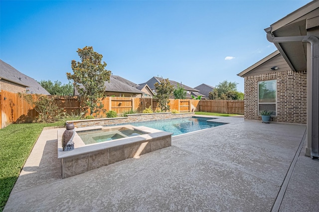 27815 Carol Collier Ct, Katy, TX 77494 - view of swimming pool featuring a patio, a fenced backyard, and an in-ground hot tub
