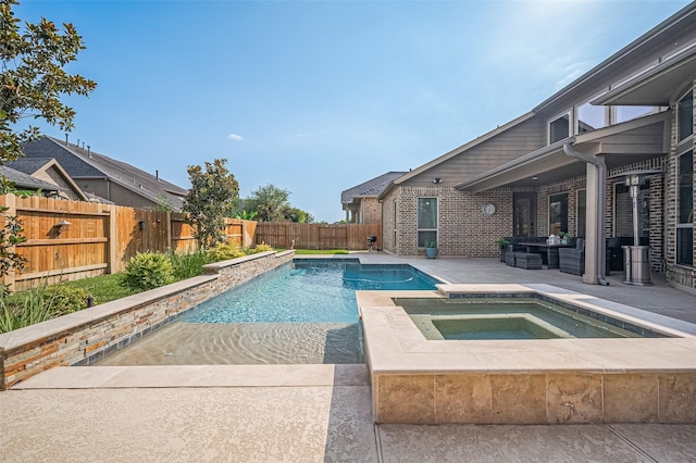 27815 Carol Collier Ct, Katy, TX 77494 - view of swimming pool with a patio area, a fenced backyard, and a pool with connected hot tub