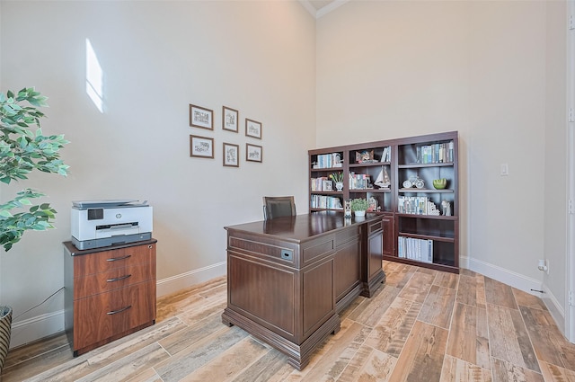 27815 Carol Collier Ct, Katy, TX 77494 - home office featuring light wood-style floors, a high ceiling, and ornamental molding