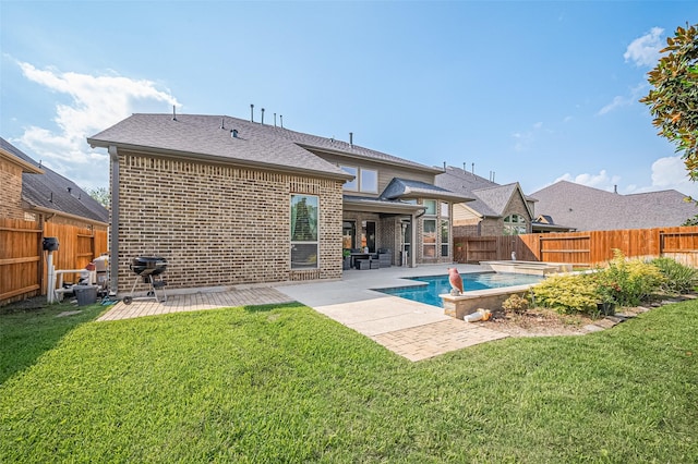27815 Carol Collier Ct, Katy, TX 77494 - rear view of house featuring brick siding, a fenced backyard, a patio area, and a shingled roof