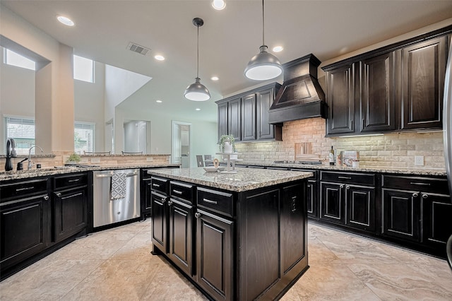 27815 Carol Collier Ct, Katy, TX 77494 - kitchen featuring premium range hood, stainless steel dishwasher, dark cabinetry, decorative backsplash, and recessed lighting