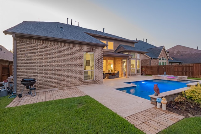 27815 Carol Collier Ct, Katy, TX 77494 - view of pool with grilling area, a fenced backyard, a patio area, and a pool with connected hot tub