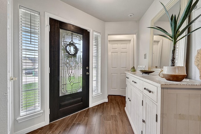 3902 Cary Creek Dr, Baytown, TX 77521 - foyer entrance featuring dark wood-style floors and baseboards