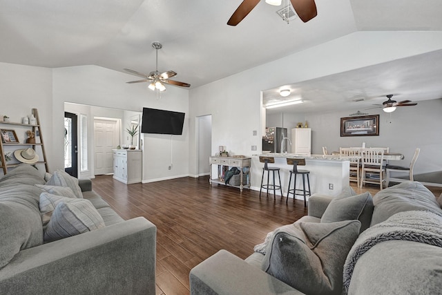 3902 Cary Creek Dr, Baytown, TX 77521 - living room with a ceiling fan, vaulted ceiling, and dark wood-style floors