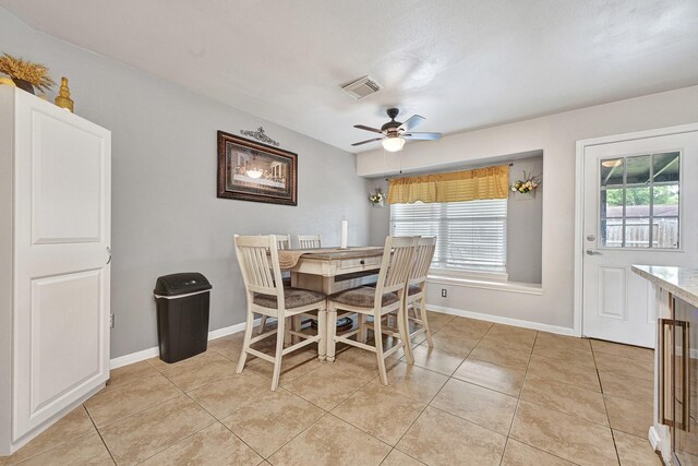 3902 Cary Creek Dr, Baytown, TX 77521 - dining room featuring light tile patterned floors, ceiling fan, and baseboards