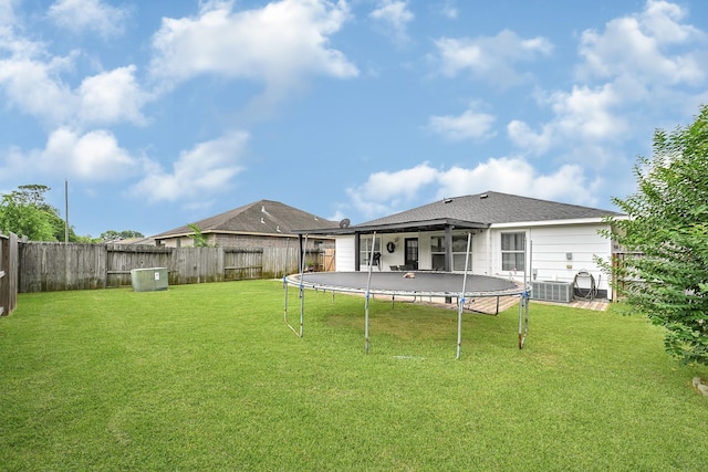 3902 Cary Creek Dr, Baytown, TX 77521 - rear view of property with a trampoline and cooling unit
