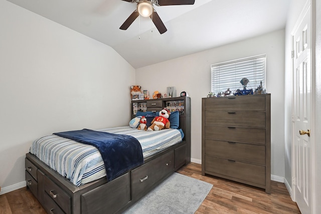 3902 Cary Creek Dr, Baytown, TX 77521 - bedroom featuring wood finished floors, lofted ceiling, baseboards, and ceiling fan