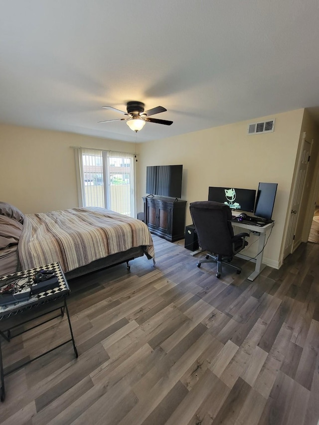 14515 Wunderlich Dr Unit 1703, Houston, TX 77069 - bedroom with wood finished floors, an office area, ceiling fan, and baseboards