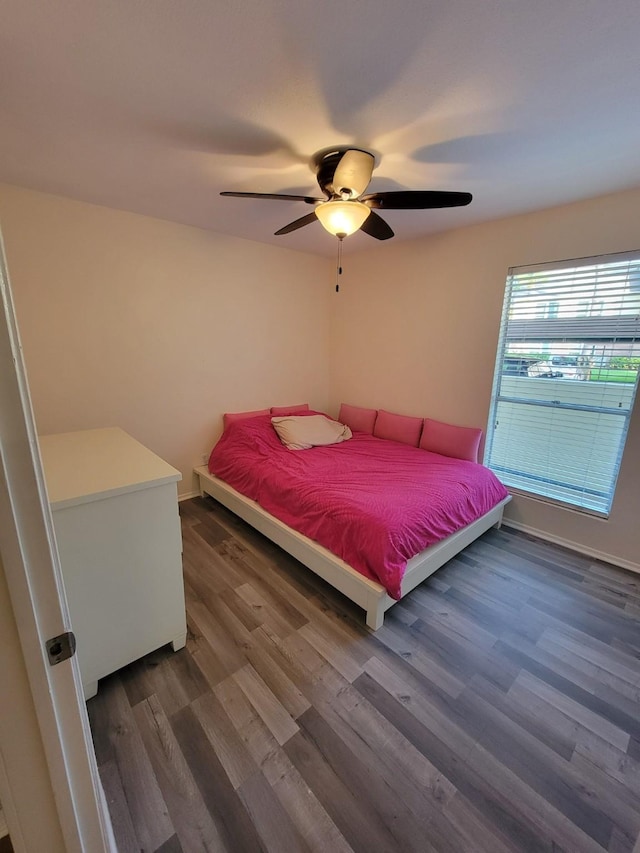 14515 Wunderlich Dr Unit 1703, Houston, TX 77069 - bedroom with wood finished floors, a ceiling fan, and baseboards