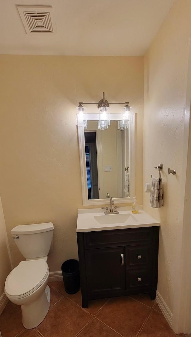 14515 Wunderlich Dr Unit 1703, Houston, TX 77069 - half bathroom featuring vanity, tile patterned flooring, toilet, and baseboards