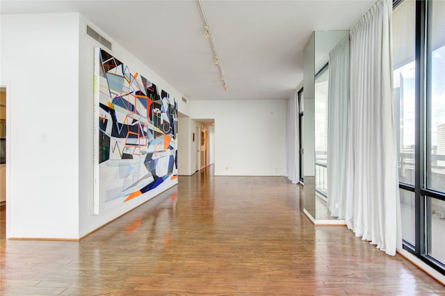 14 Greenway Plz Unit 19P, Houston, TX 77046 - corridor with plenty of natural light, wood finished floors, and rail lighting