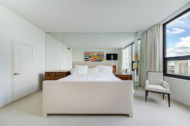 14 Greenway Plz Unit 19P, Houston, TX 77046 - bedroom with light carpet and baseboards