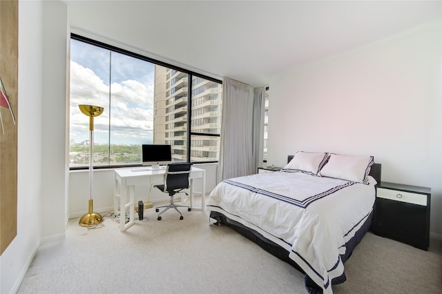 14 Greenway Plz Unit 19P, Houston, TX 77046 - carpeted bedroom featuring an office area and baseboards
