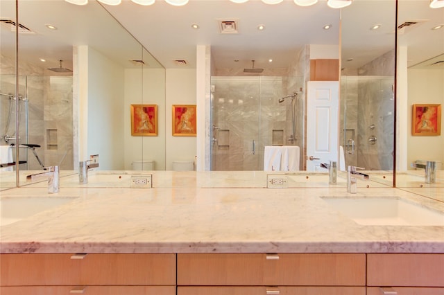 14 Greenway Plz Unit 19P, Houston, TX 77046 - full bath featuring a marble finish shower, double vanity, and recessed lighting