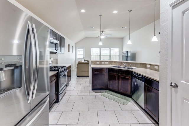 619 Palo Alto Ct, Rosharon, TX 77583 - kitchen featuring appliances with stainless steel finishes, a sink, vaulted ceiling, a ceiling fan, and open floor plan