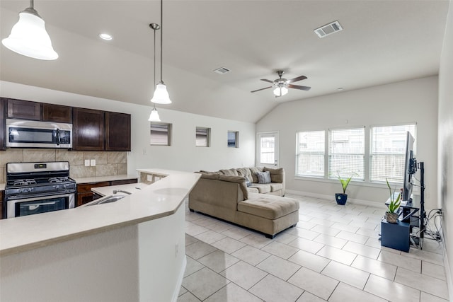 619 Palo Alto Ct, Rosharon, TX 77583 - kitchen featuring appliances with stainless steel finishes, light countertops, lofted ceiling, backsplash, and ceiling fan