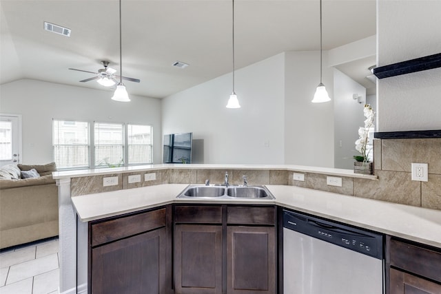 619 Palo Alto Ct, Rosharon, TX 77583 - kitchen featuring dishwasher, a sink, dark brown cabinets, light countertops, and lofted ceiling