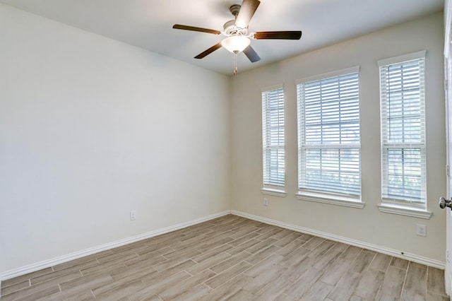28618 Monarch Cliffs Dr, Fulshear, TX 77441 - spare room featuring light wood-style flooring, healthy amount of natural light, baseboards, and ceiling fan