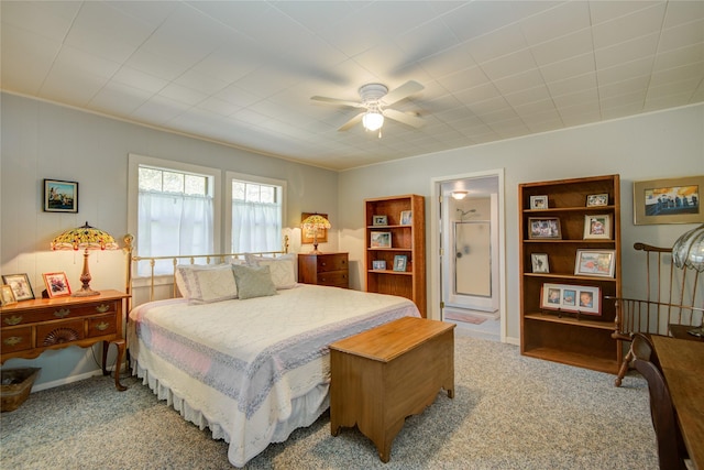 409 Wildwood Dr, Onalaska, TX 77360 - bedroom with carpet floors, ceiling fan, and ensuite bath
