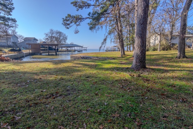 409 Wildwood Dr, Onalaska, TX 77360 - view of green lawn featuring a water view