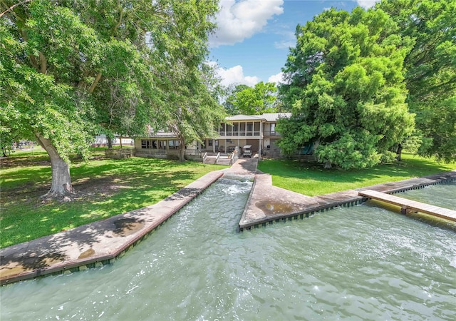 409 Wildwood Dr, Onalaska, TX 77360 - dock area with a lawn and a water view