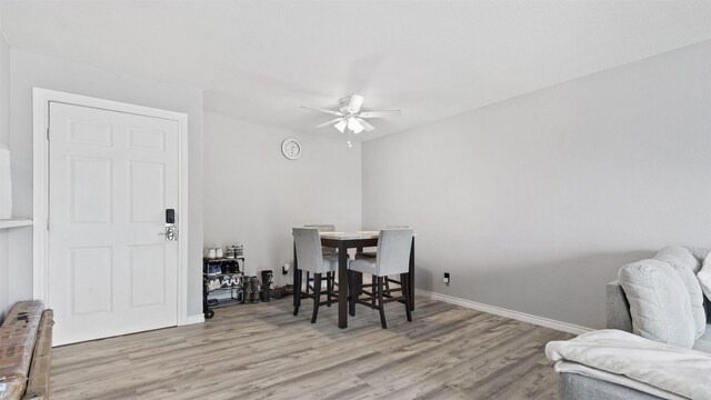 212 Plaza Verde Dr Unit F-22, Houston, TX 77038 - dining area featuring wood finished floors, ceiling fan, and baseboards