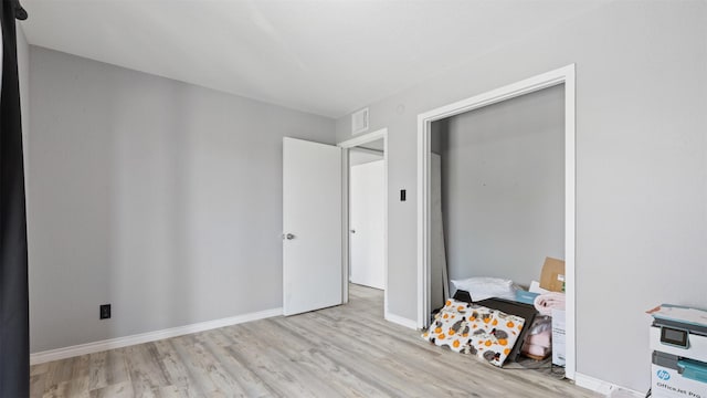 212 Plaza Verde Dr Unit F-22, Houston, TX 77038 - bedroom with wood finished floors and baseboards