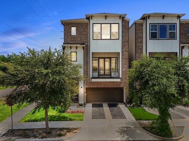 2607 Mcilhenny St, Houston, TX 77004 - view of front of home featuring concrete driveway, an attached garage, and brick siding
