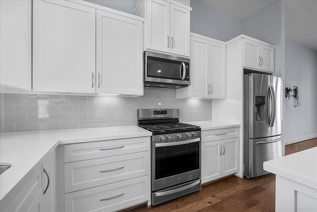 2607 Mcilhenny St, Houston, TX 77004 - kitchen with stainless steel appliances and white cabinetry