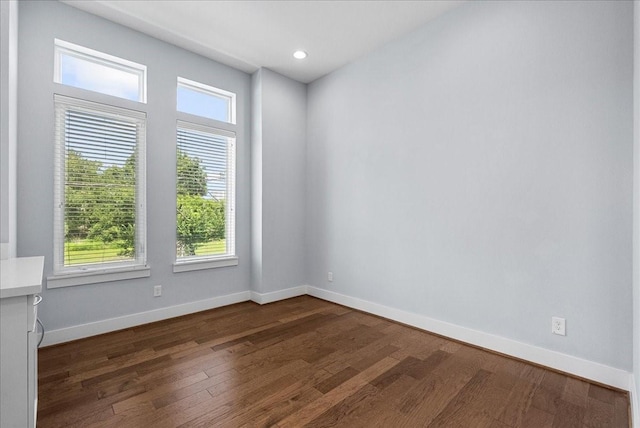2607 Mcilhenny St, Houston, TX 77004 - spare room featuring dark wood finished floors, healthy amount of natural light, baseboards, and recessed lighting