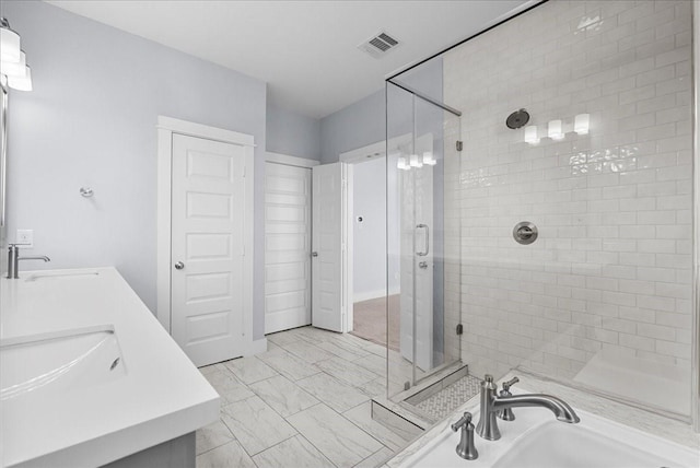 2607 Mcilhenny St, Houston, TX 77004 - bathroom with a stall shower, double vanity, and marble look tiles